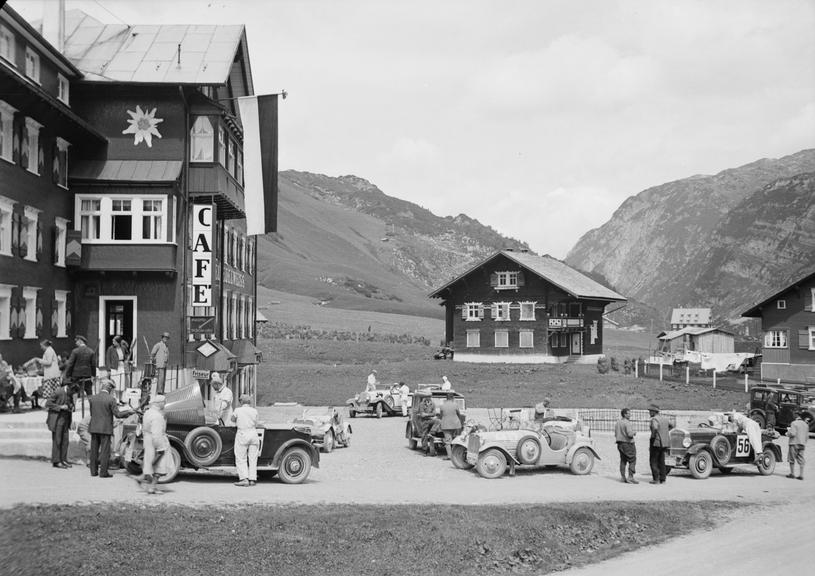 Racing cars parked near chalet buildings