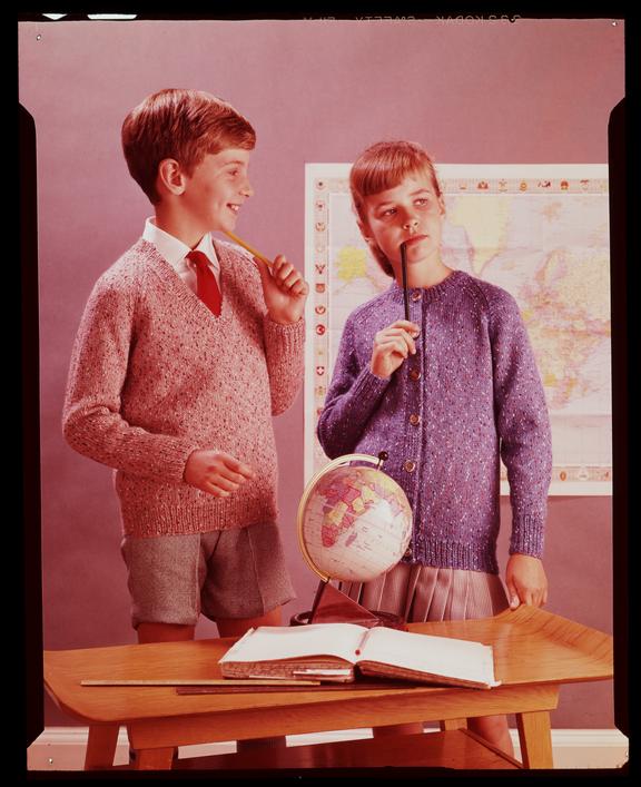 Boy and girl with map and globe