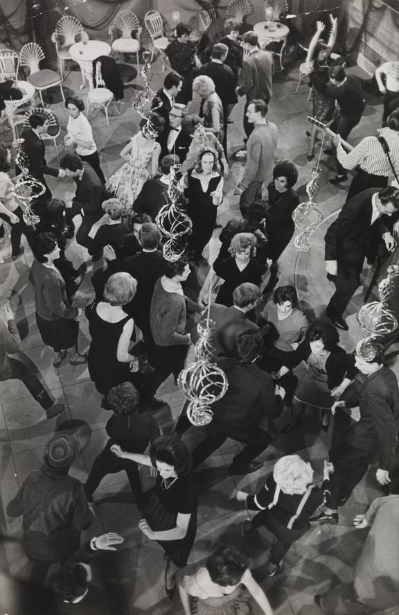 'Group of people dancing The Twist at a party'
    A photograph