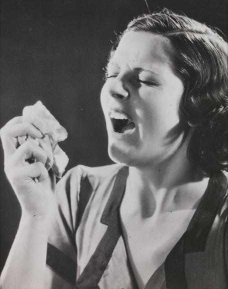 Woman sneezing