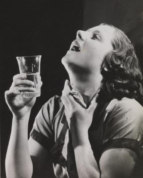 Woman gargling water