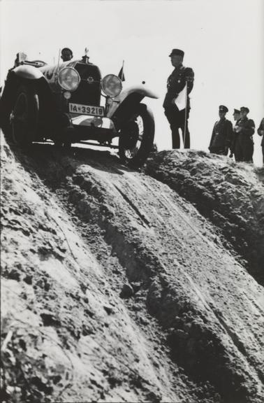 Rally car at the top of a steep slope