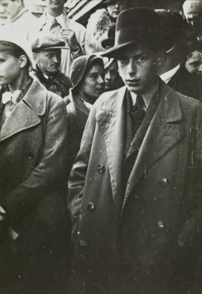 Young man in the crowd at a race