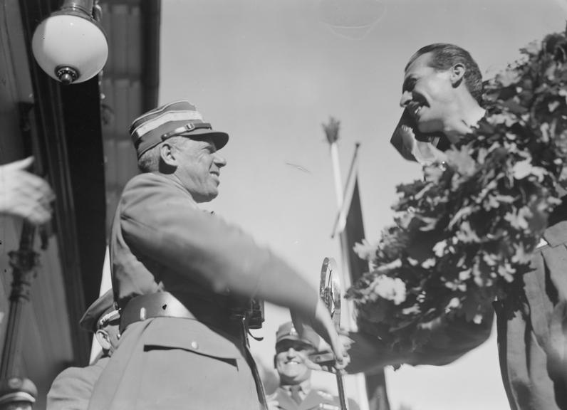 Officer shaking hands with race winner