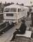 Young train spotter at station with the ghost train in background