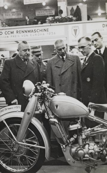 Men looking at a motorcycle