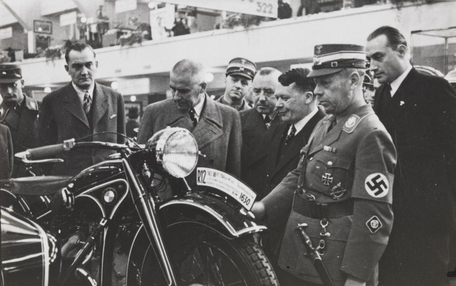 Nazi officer looking at a motorcycle