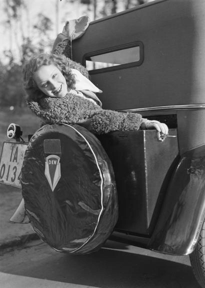 Smiling woman in the additional seat of a DKW car