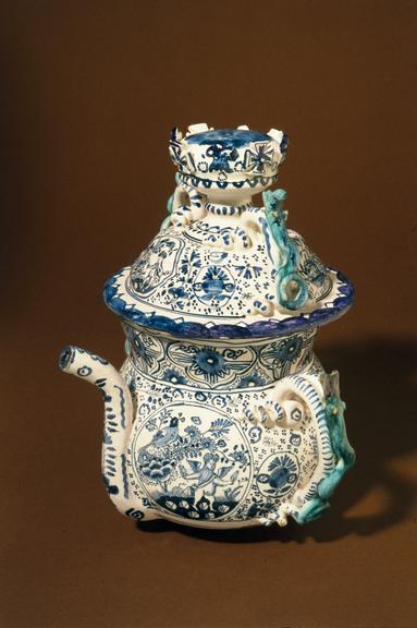 Elaborate posset pot, tin glazed earthenware