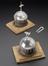 Two globes used in determining the densities of gases.