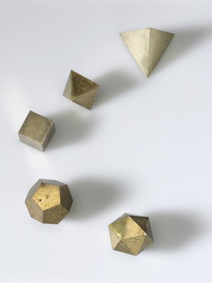 five brass models of the five regular Platonic solid bodies: tetrahedron (edge: 45 mm)