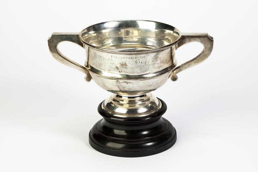 Silver cup cycling trophy won by Wilf Higgins.