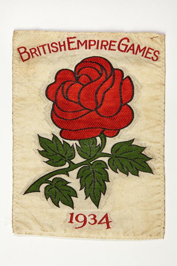 Red rose badge from a competition jersey worn by cyclist Wilf