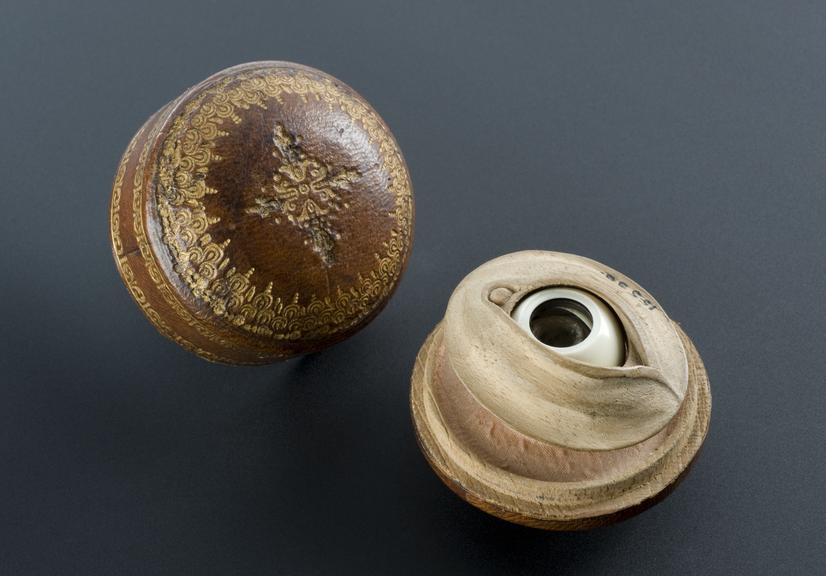 Ivory and horn artificial eye in leather covered box, Italian