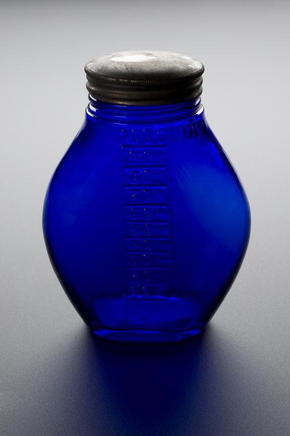 Blue glass sputum bottle with metal cap and graduated scale in