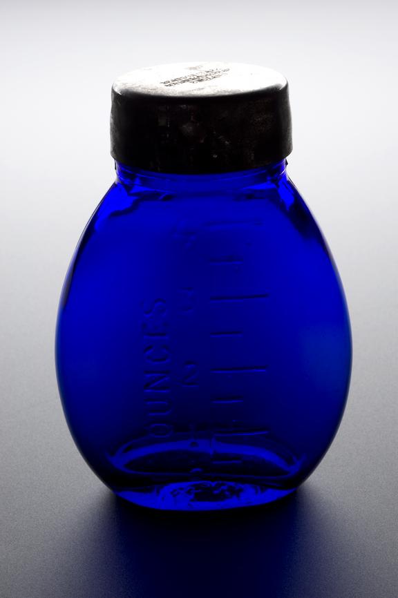 Blue glass sputum bottle made by Beatson Clark and Co