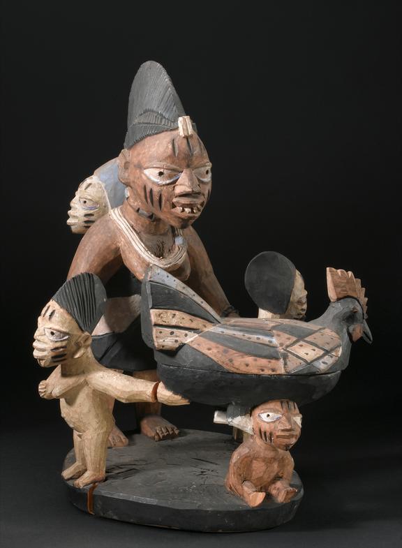 Carved wooden ritual bowl in the form of a hen supported by