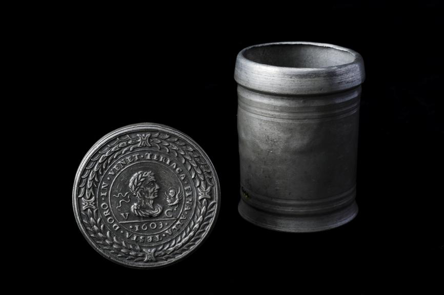 Cylindrical pewter theriac container with drop of original