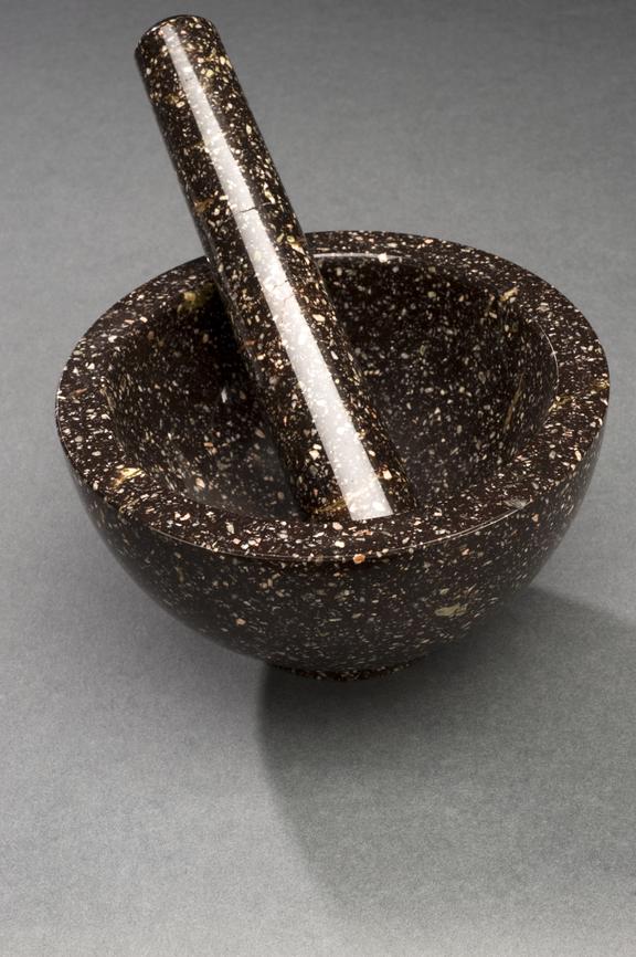 Maroon marble bowl-shaped mortar and tapering pestle