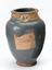 Blue glazed earthenware storage jar containing medical