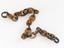 Linked chain made of interlinks of light brown and mottled