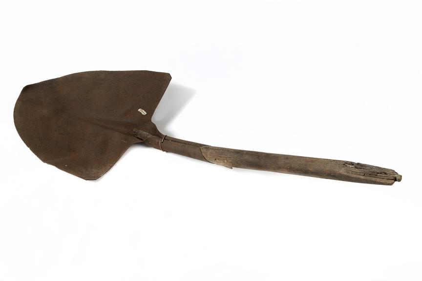 Long handled shovel..Photographed on a white background.