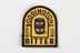 Embroidered badge bearing Boddingtons logo