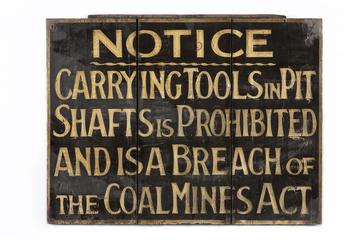 A coal mine notice sign