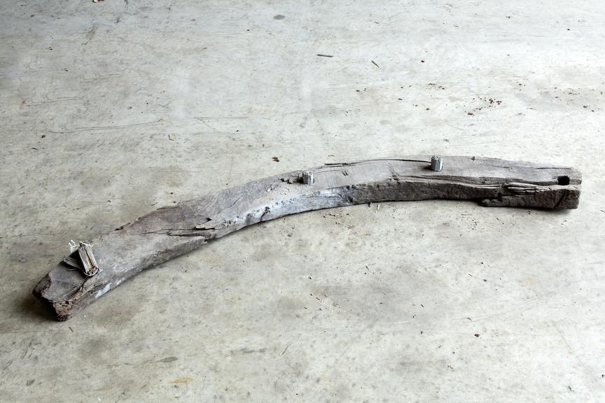 wood pit prop.
Photographed on a concrete floor.