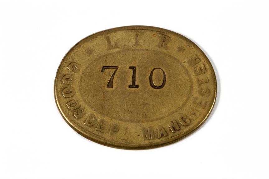 Brass oval pay check (similar to a token)