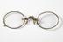 Gold-rimmed pince-nez with spring nose-clips