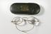 Oval-lens, gold-framed spectacles in case, made by A