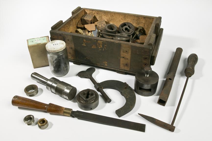 Wooden box with hand tools.
Photographed on a white background.