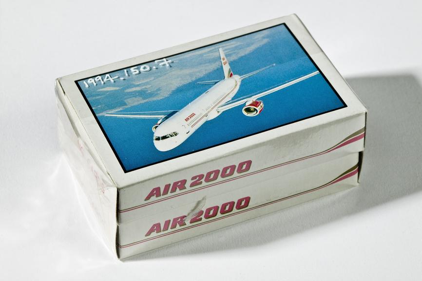 Wrapped set of playing cards featuring Air 2000 airliner