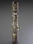 Tobacco pipe, encrusted with coins, buttons, badges, shells, plaques and crests