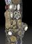 Tobacco pipe, encrusted with coins, buttons, badges, shells, plaques and crests