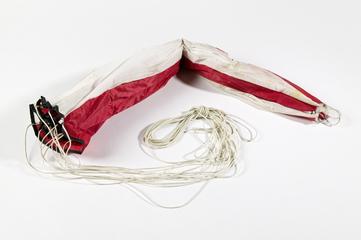 Red and white parachute for a Powermax Merlin Tracker unit