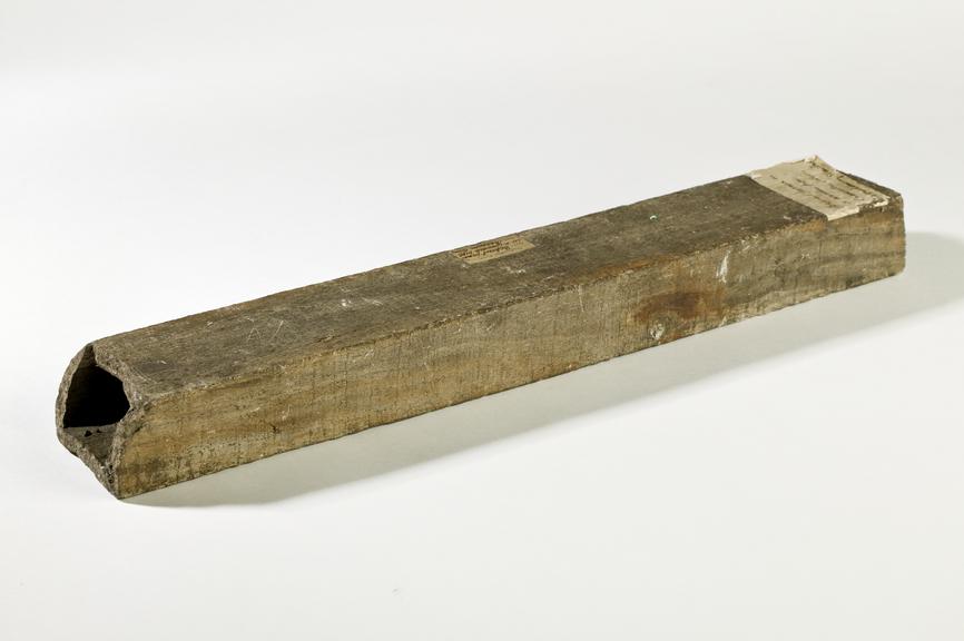 Wooden pipe containing concreted deposit from Chadderton