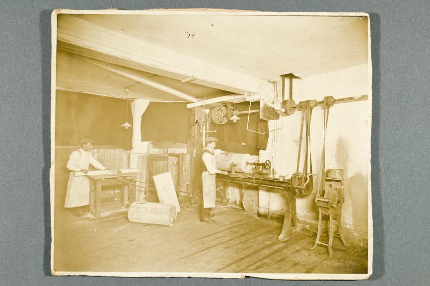 Sepia photograph showing the construction of barrel pianos by D