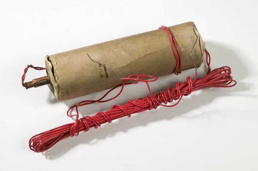 Dummy explosive with attached fuse wire, c
