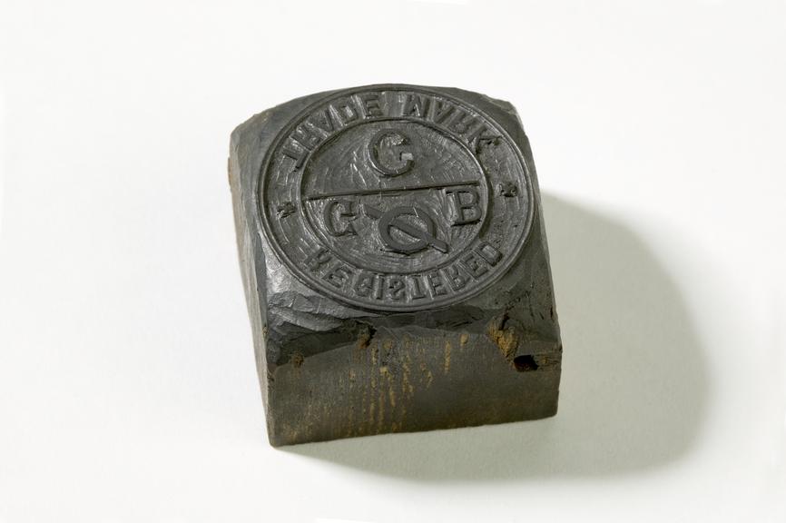 Wooden stamp with relief carving of Grimshaw Brothers