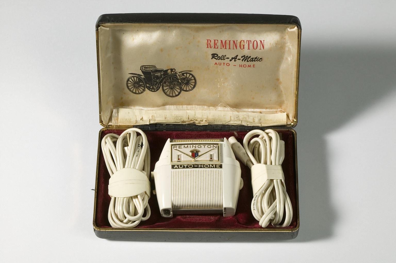 Boxed 'Roll-A-Matic' electric shaver by Remington by Remington