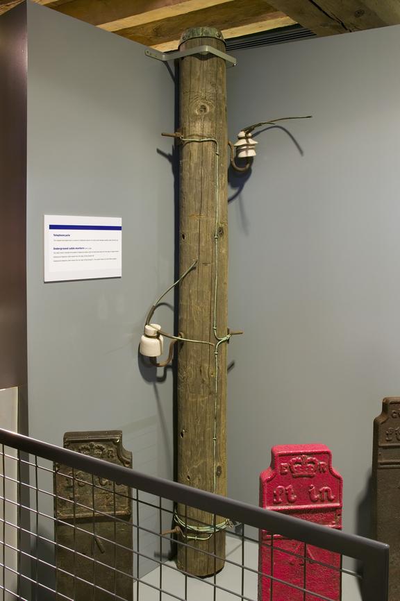 telephone pole photographed on display in the Connecting