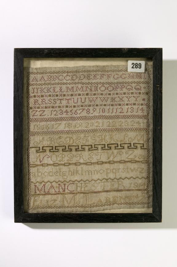 Framed cross stitched alphabet textile panel made in Manchester