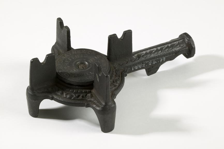 Gas-heated boiling ringPhotographed on a white background.