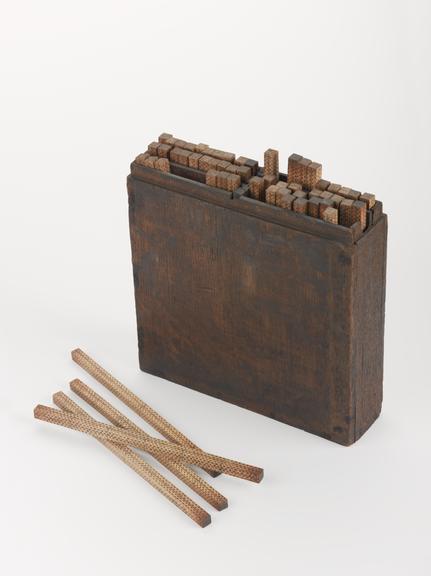 Box of sixty boxwood calculating rods