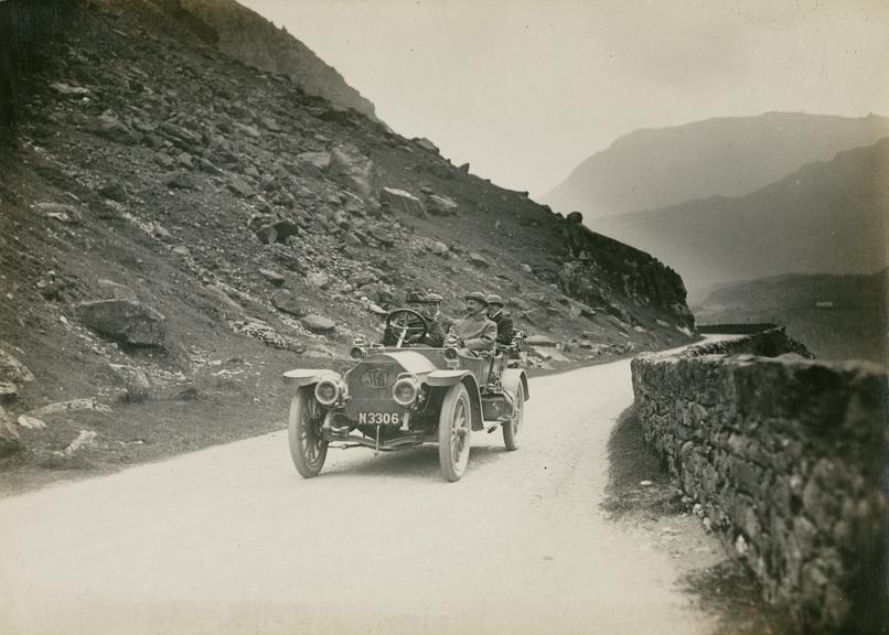 Photograph of a car driving through the Nant Francon Pass