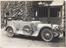 Photograph of a Laundau car outside a garage (Photograph)