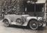 Photograph of a Laundau car outside a garage (Photograph)