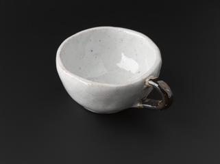 Shape deformed from an annulus one of four solid bodies (in clay) of genus 1